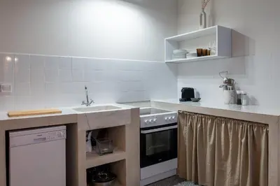a kitchen with a sink and a stove at Eden in Athens
