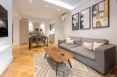 a living room with a couch and a table at Phaedrus Living: Executive Flat Kolonaki in Athens