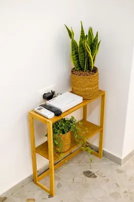 a desk with a keyboard and two plants on it at Lux Residence Near Acropolis VIPGreece in Athens