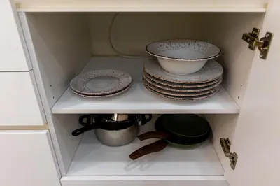 a cabinet filled with plates and bowls and dishes at Lux Residence Near Acropolis VIPGreece in Athens