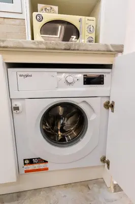 a washer and dryer in a kitchen with a microwave at Lux Residence Near Acropolis VIPGreece in Athens