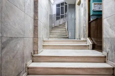 a stairway in a building with concrete steps at Bravo 2 City Center Room in Athens