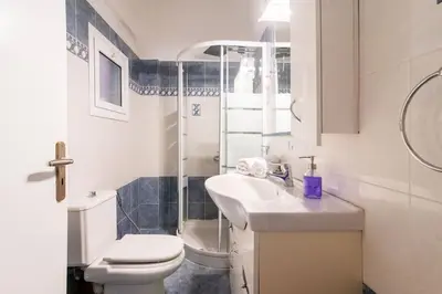 a bathroom with a toilet and a sink and a shower at Bravo 2 City Center Room in Athens