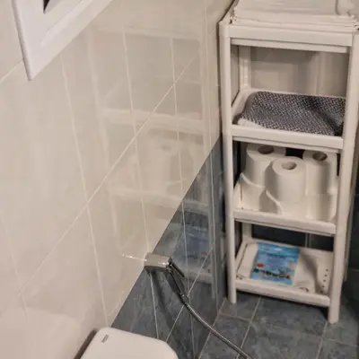 a bathroom with a white toilet in a room at Bravo 2 City Center Room in Athens