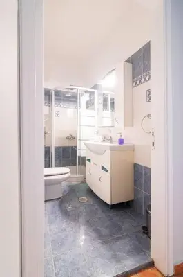 a bathroom with a toilet and a sink at Bravo 2 City Center Room in Athens