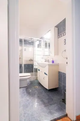 a bathroom with a toilet and a sink and a tub at Bravo 2 City Center Room in Athens