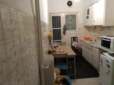 a small kitchen with a sink and a refrigerator at Central appartement in Athens