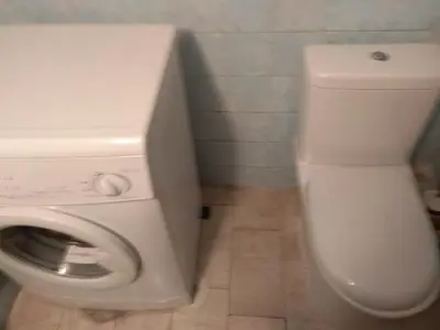 a bathroom with a white toilet and a sink at Central appartement in Athens