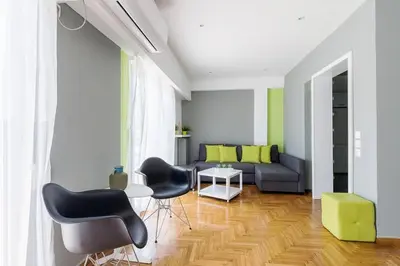 a living room with a couch and two chairs at Sunlit 2BR Oasis in Metaxourghio 3min from metro in Athens