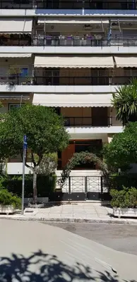 a building with a gate in front of it at Φωτεινό κομψό & άνετο διαμέρισμα κοντά στο κέντρο! in Athens