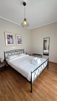 a bedroom with a large bed in a room at Marina Zeas Bella Vista in Piraeus