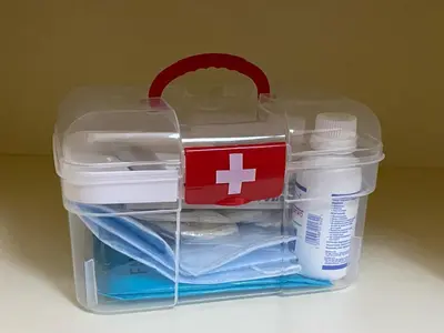 a plastic container with a red cross on top of it at Le musée in Athens