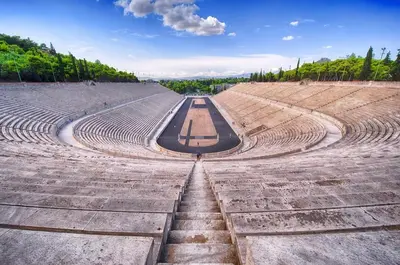 an amphitheater with a long road in the middle at Le musée in Athens