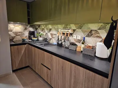 a kitchen with a sink and a counter top at Ellis Apartment in Athens
