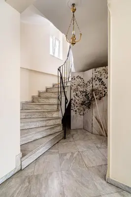 a staircase in a house with a chandelier at Live like an Athenian! in Athens