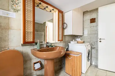 a bathroom with a sink and a mirror at Live like an Athenian! in Athens