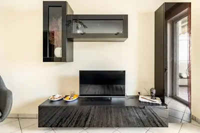 a living room with a black coffee table at Live like an Athenian! in Athens