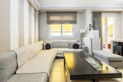 a living room with a couch and a table at Best Family House,Acropolis view,5 min from metro in Athens