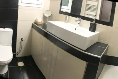 a bathroom with a sink and a toilet at Best Family House,Acropolis view,5 min from metro in Athens