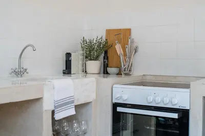 a kitchen with a sink and a stove at Jade in Athens
