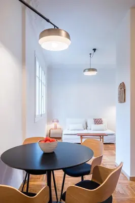 a living room with a table and chairs at Crane in Athens