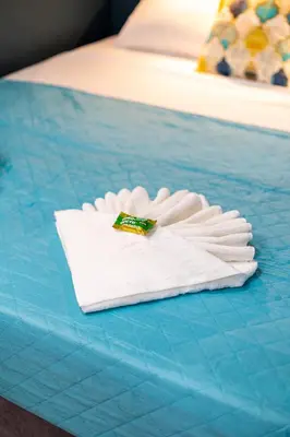 a pile of white napkins on a blue table at Bright Apartment In The Center VIPGreece in Athens