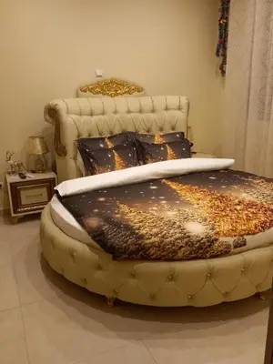 a large bed in a room with a chair at Penthouse Oasis in Athens