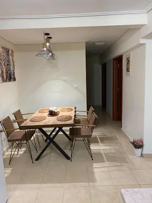 a dining room table and chairs in a room at Garden View Apartment in Athens