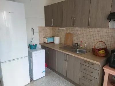 a kitchen with a sink and a white refrigerator at Retro Stay Athens in Athens