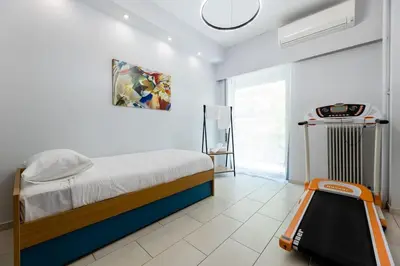 a bedroom with a bed with a scale in it at Luxury flat at archaeological museum in Athens