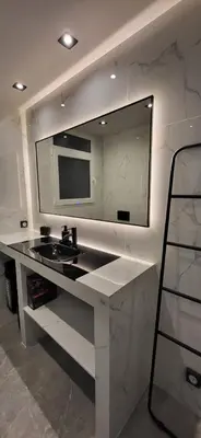 a bathroom with a sink and a large mirror at LView Acropolis in Athens