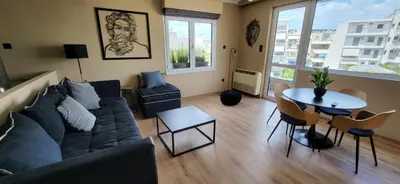 a living room with a couch and a table at LView Acropolis in Athens