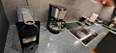 a kitchen counter with a coffee maker and a blender at LView Acropolis in Athens
