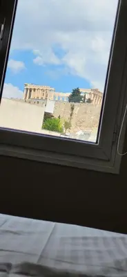 a window in a room with a view of a building at LView Acropolis in Athens