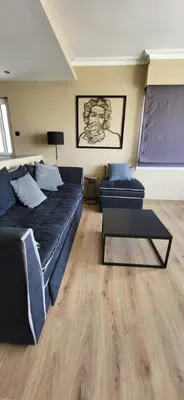 a living room with a couch and a table at LView Acropolis in Athens