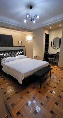 a large bedroom with a large bed and a desk at LView Zeus Temple in Athens