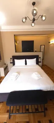 a bedroom with a large bed with two towels on it at LView Zeus Temple in Athens