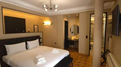 a bedroom with a bed with two towels on it at LView Zeus Temple in Athens