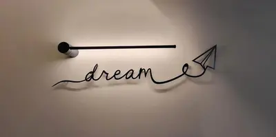 a sign that says dream with an arrow and a paper at LView Zeus Temple in Athens