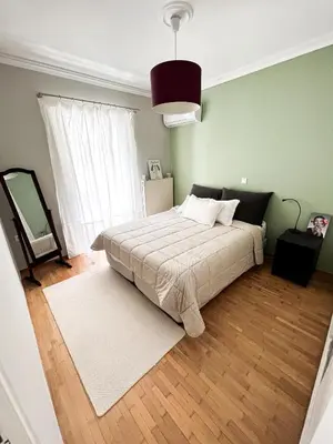 a bedroom with a bed and a large window at Porto Pireo Penthouse Sea View in Piraeus