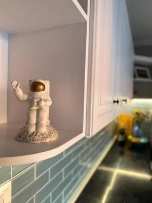 a figurine sitting on a shelf in a kitchen at Porto Pireo Penthouse Sea View in Piraeus
