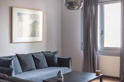 a living room with a couch and a table at Syntagma SQ Residence in Athens