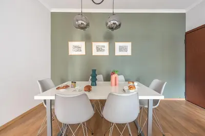 a dining room with a white table and white chairs at Syntagma SQ Residence in Athens