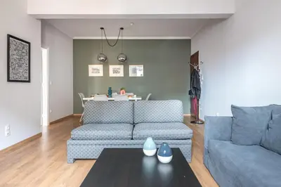 a living room with a couch and a table at Syntagma SQ Residence in Athens