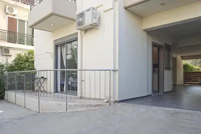 a balcony of a building with a air conditioner at Glyfada Cozy Studio, WiFi, AC in Athens