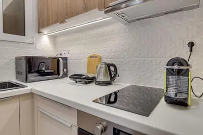 a kitchen counter with a coffee maker and a toaster at Deluxe Urban 2BR Apt by Nat. Archaelogical Museum in Athens