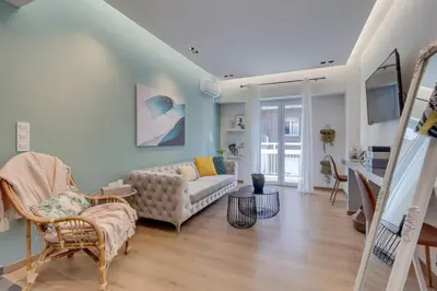 a living room with a couch and a table at Deluxe Urban 2BR Apt by Nat. Archaelogical Museum in Athens
