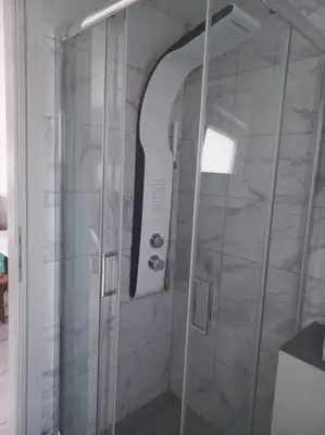 a shower with a glass door in a bathroom at studio-02 in Metókhi