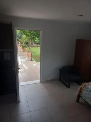 an empty room with a door open to a patio at studio-02 in Metókhi