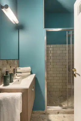 a bathroom with a sink and a shower at AnapironPolemou5 - Elegance meets charm in a posh in Athens